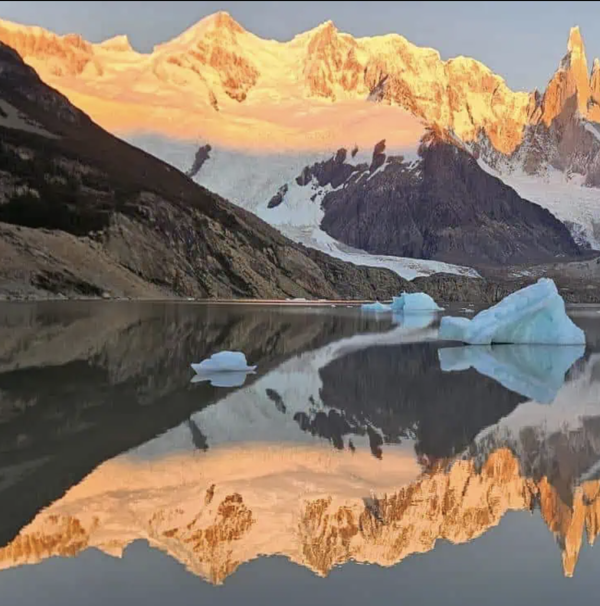 Patagonia mountain peaks and glacial lake at sunrise
